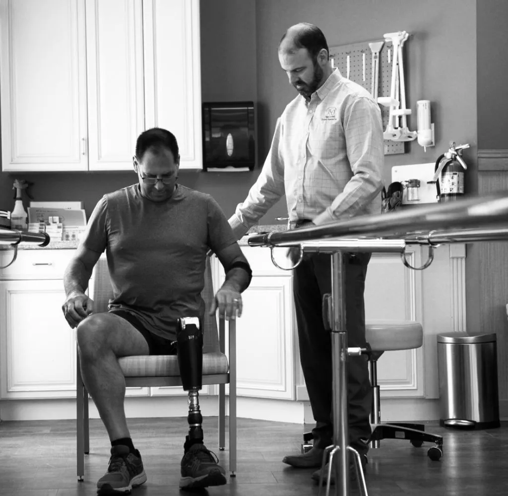 Helping patient with a lower extremity prosthetic